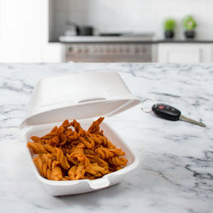 50HT1 white XPS foam sandwich container in a takeout food setting