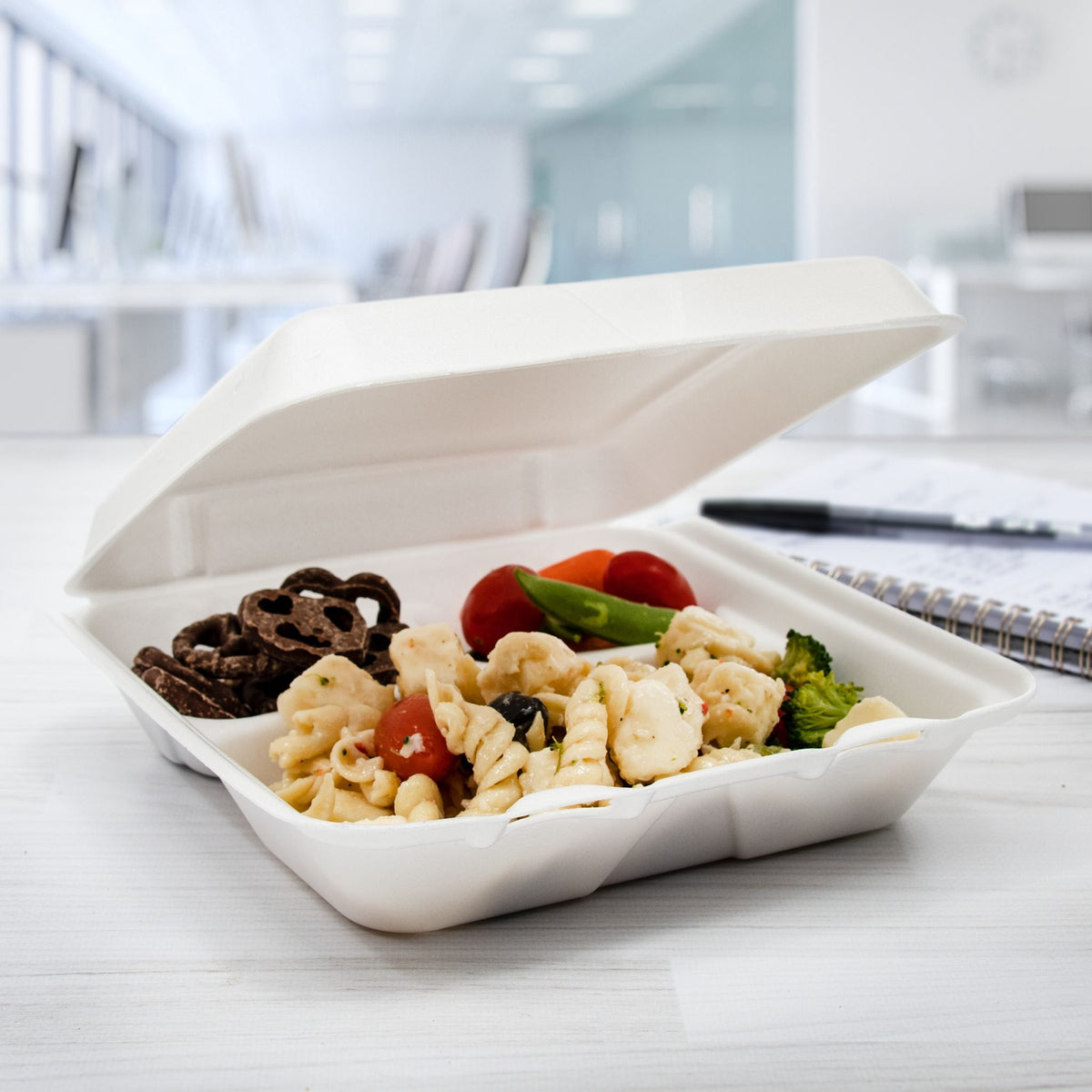 Dart 80HT3R three-compartment foam takeout container holding a prepared meal