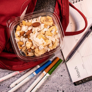 Dart CH12DEF SafeSeal container holding trail mix in a red backpack