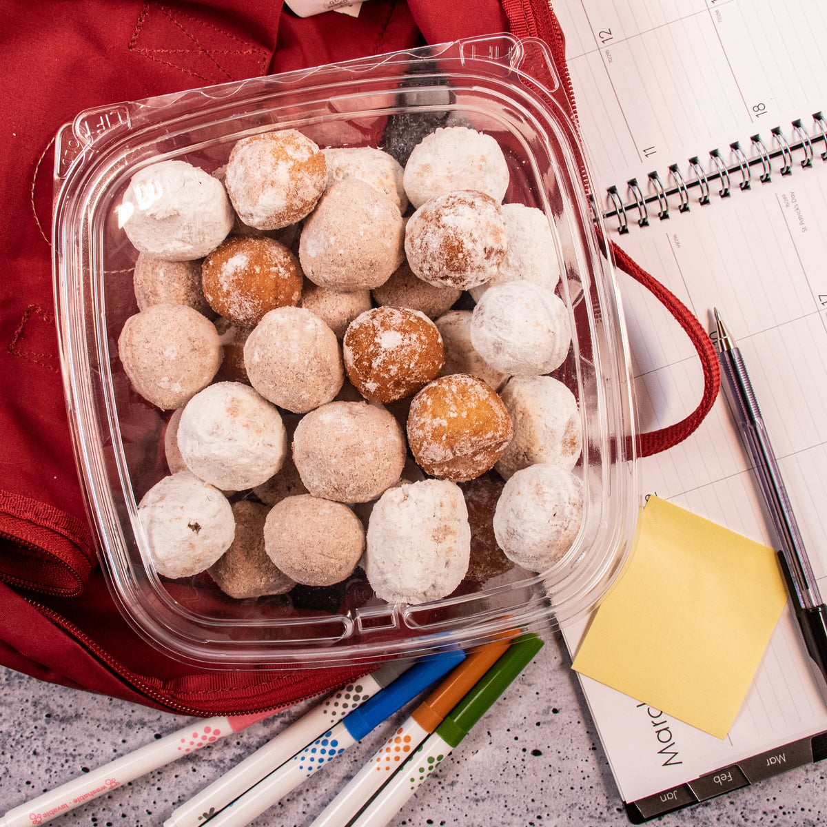 Dart CH48DEF SafeSeal container holding doughnut holes in a backpack