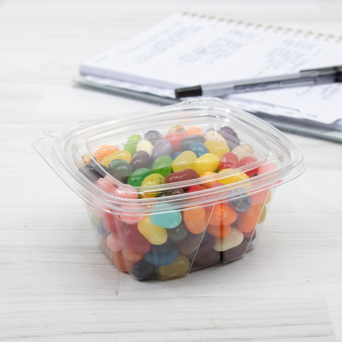 Dart CH4DEF SafeSeal container holding jelly beans on a table