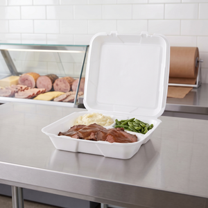 CKF 87519 FST-6A white foam hinged 3 compartment container open on a deli counter holding sliced roast beef with gravy, mashed potatoes and green beans