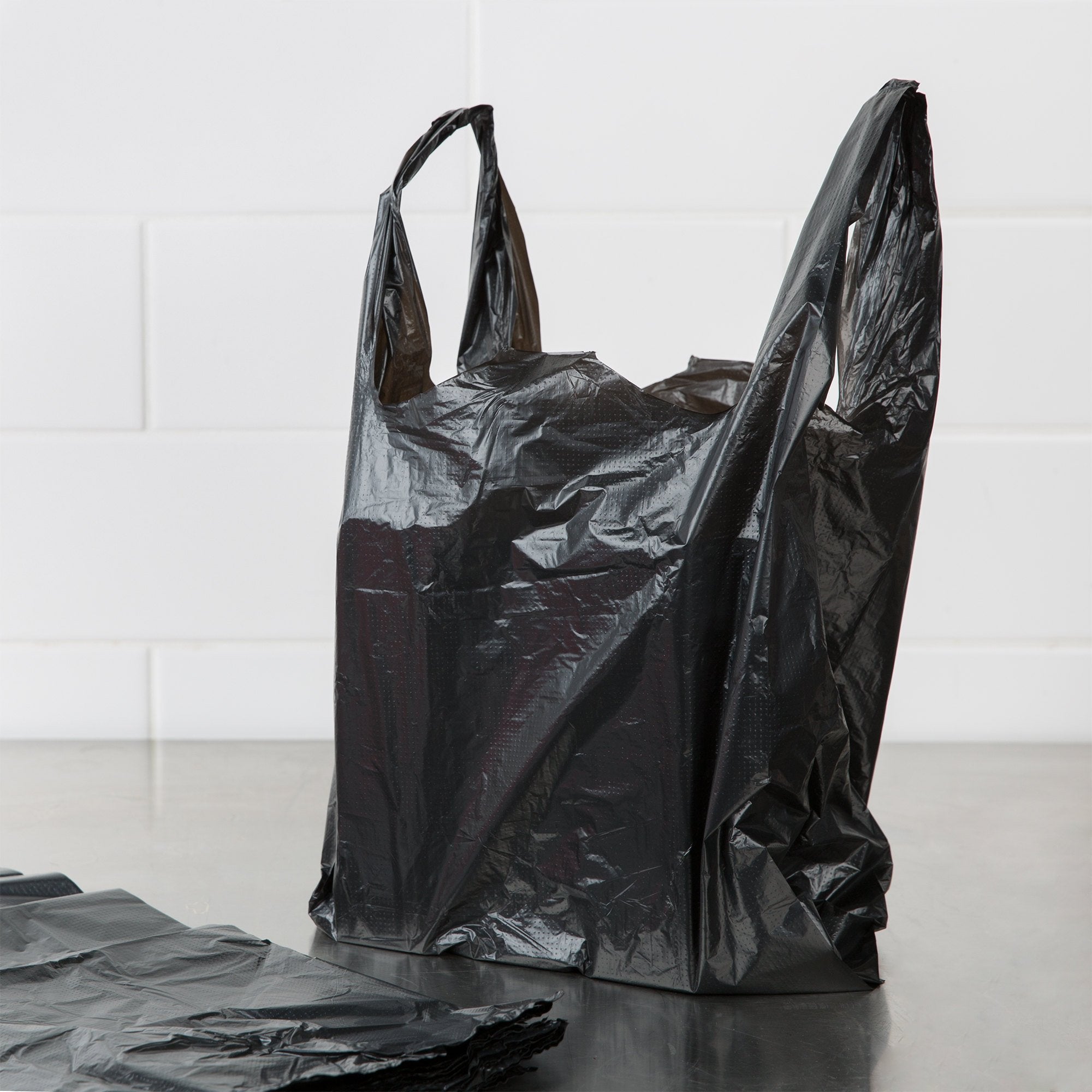Win Sone - 1/8 Size Black Medium-Duty Plastic T-Shirt Bag - Case of 600