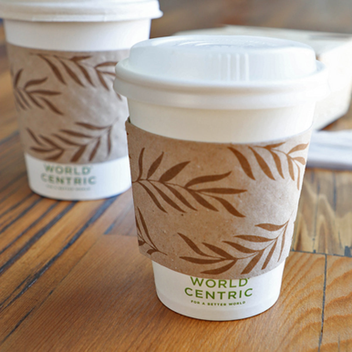 World Centric SL-PA-ME recycled paper sleeve fitted on an 8 oz hot cup