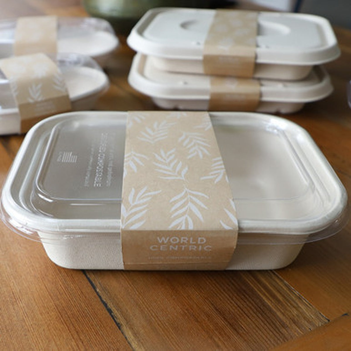 World Centric SL-PA-TR60 paper sleeve securing a compatible 60 oz fiber container