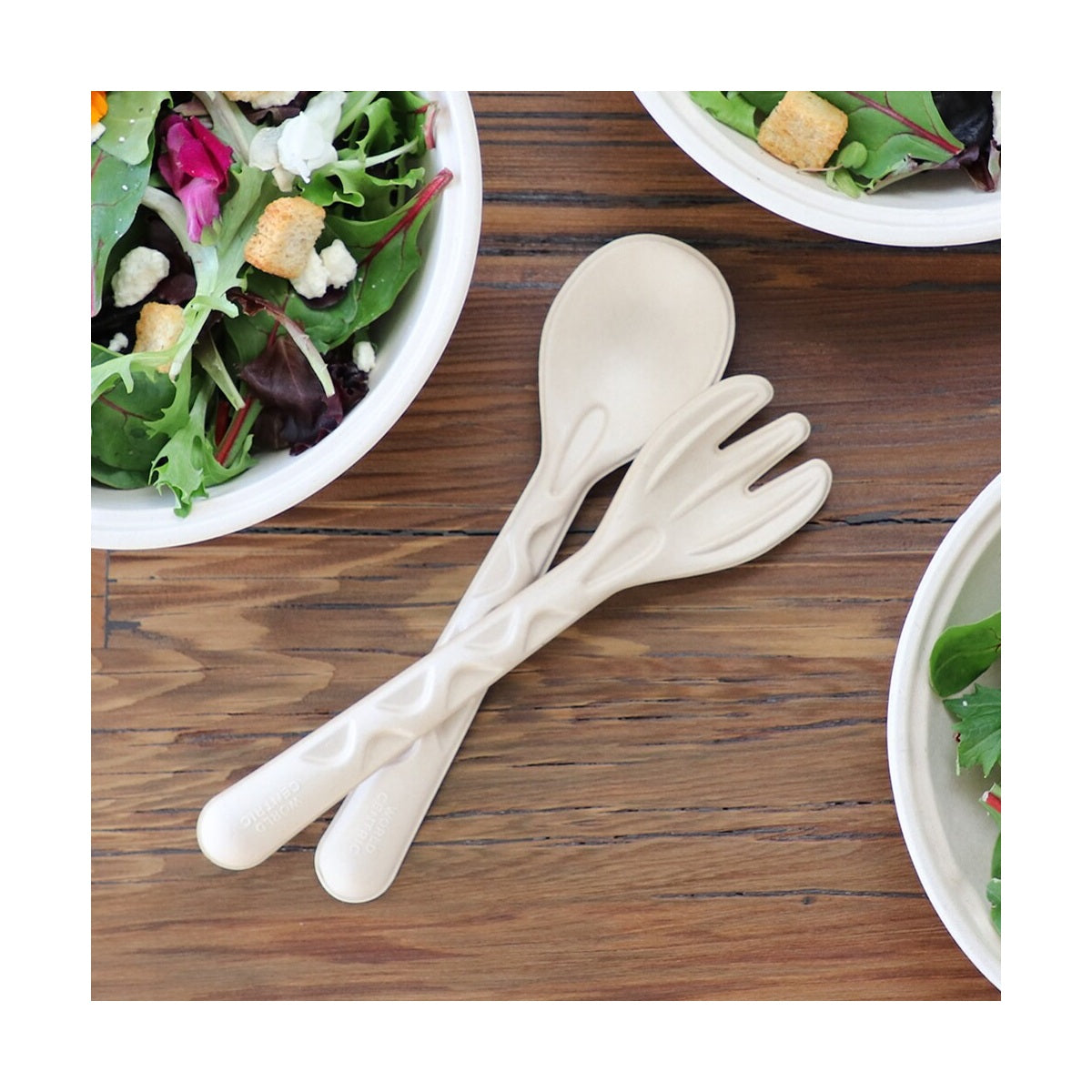 World Centric 10-inch plant-fiber serving fork in a buffet setting