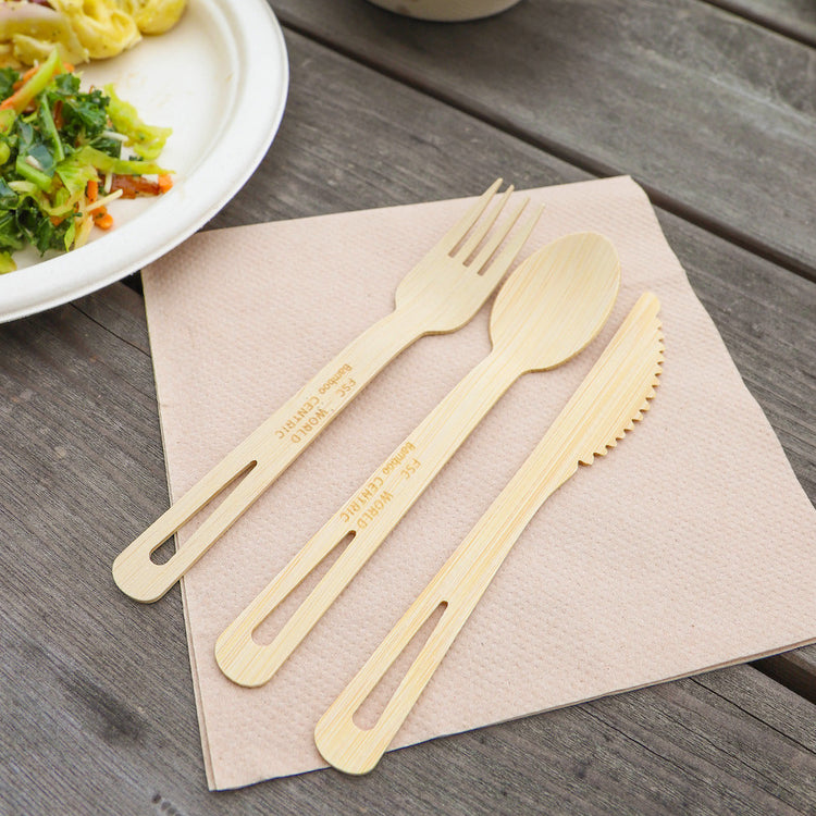 World Centric bamboo knife with matching bamboo cutlery on a café table