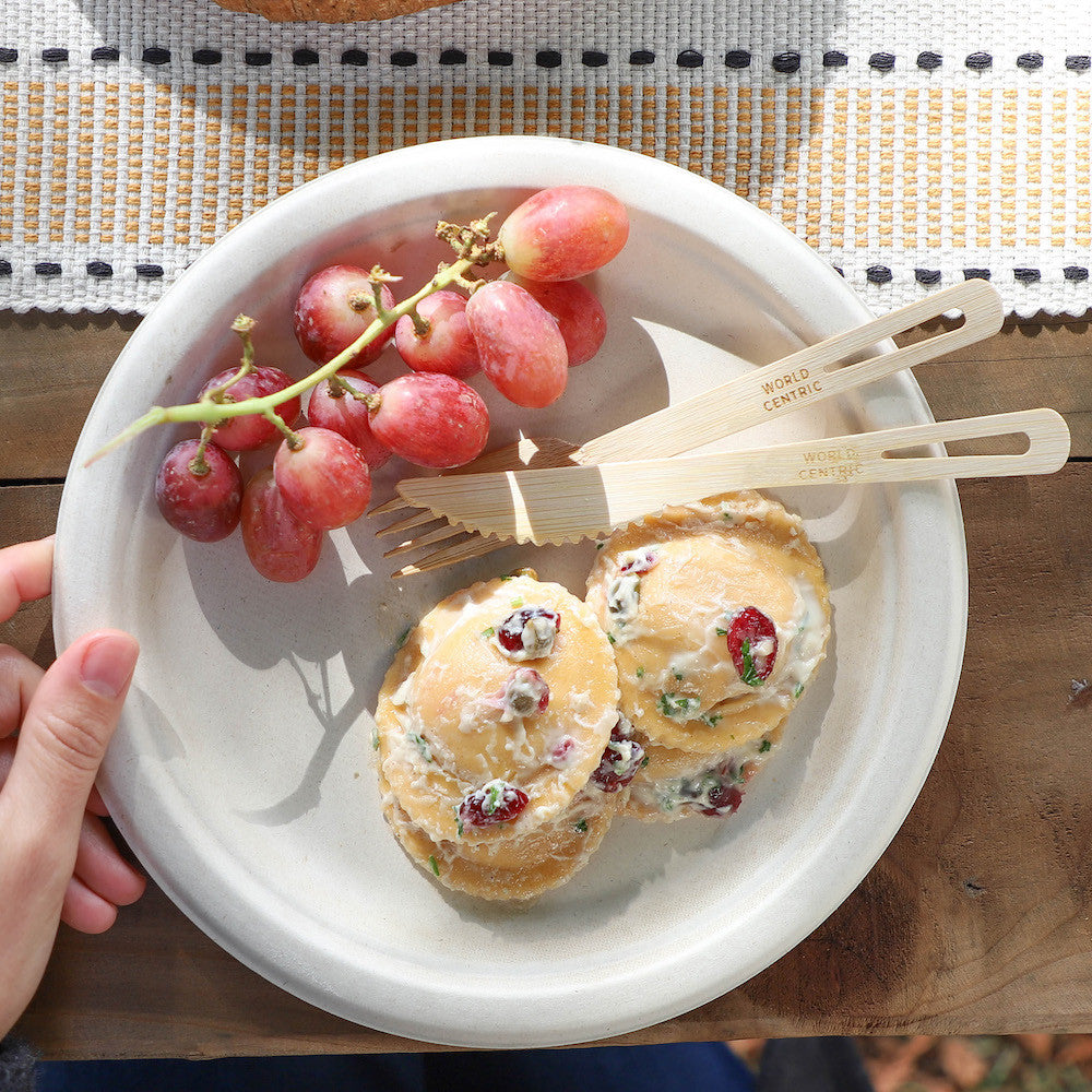 World Centric bamboo knives serving pastries and fruit on a compostable plate