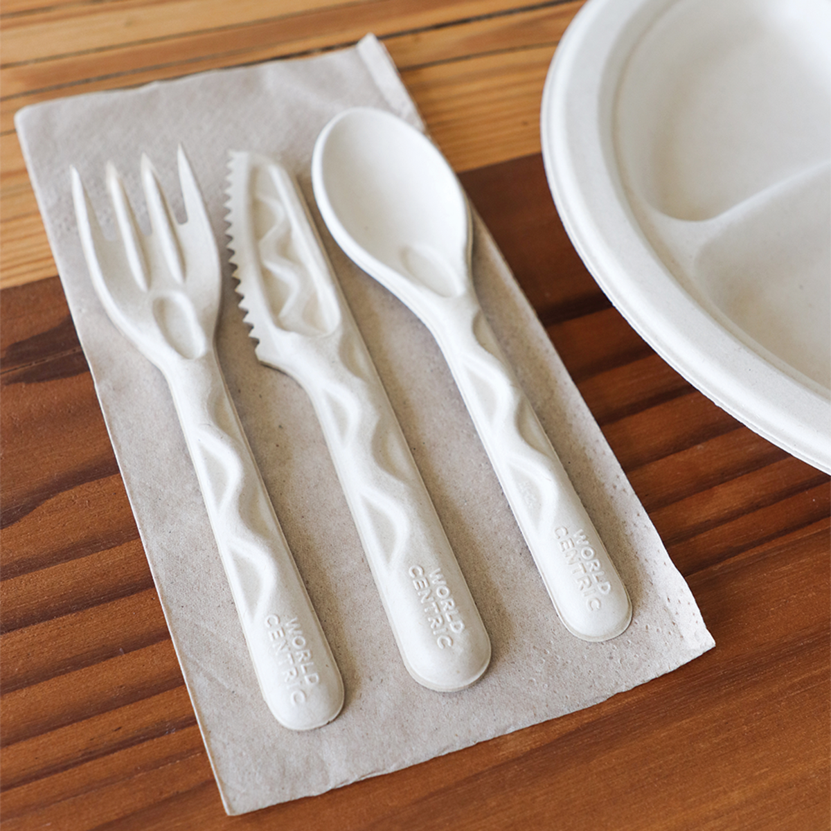 World Centric fiber knife with matching fiber cutlery at a compostable place setting