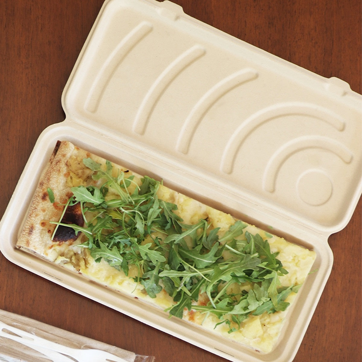 World Centric plant-fiber flatbread box holding a prepared flatbread