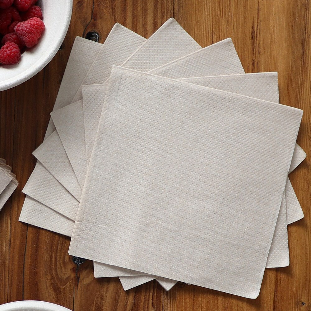 World Centric unbleached lunch napkins arranged on a café table