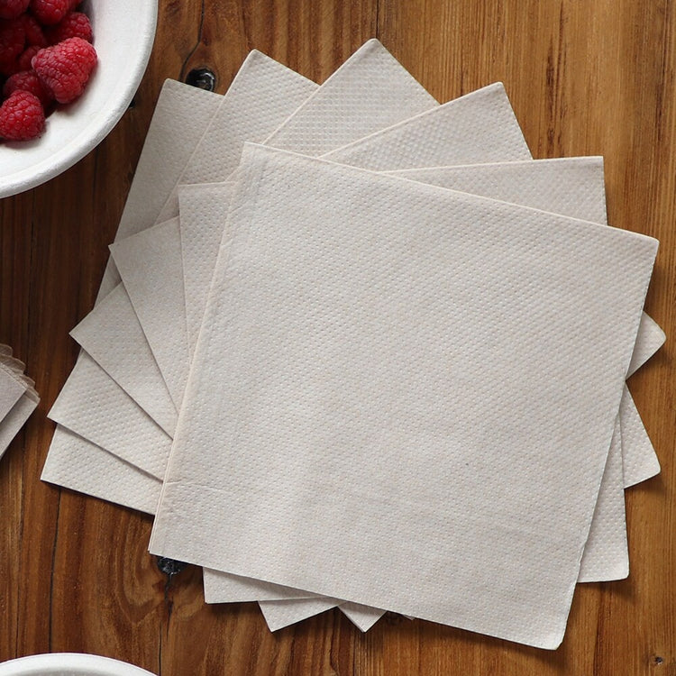 World Centric unbleached lunch napkins arranged on a café table