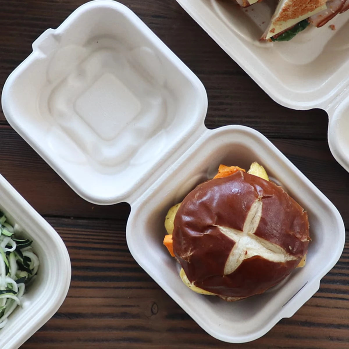 World Centric TO-SC-U15B-LFP fiber burger box shown with a prepared burger