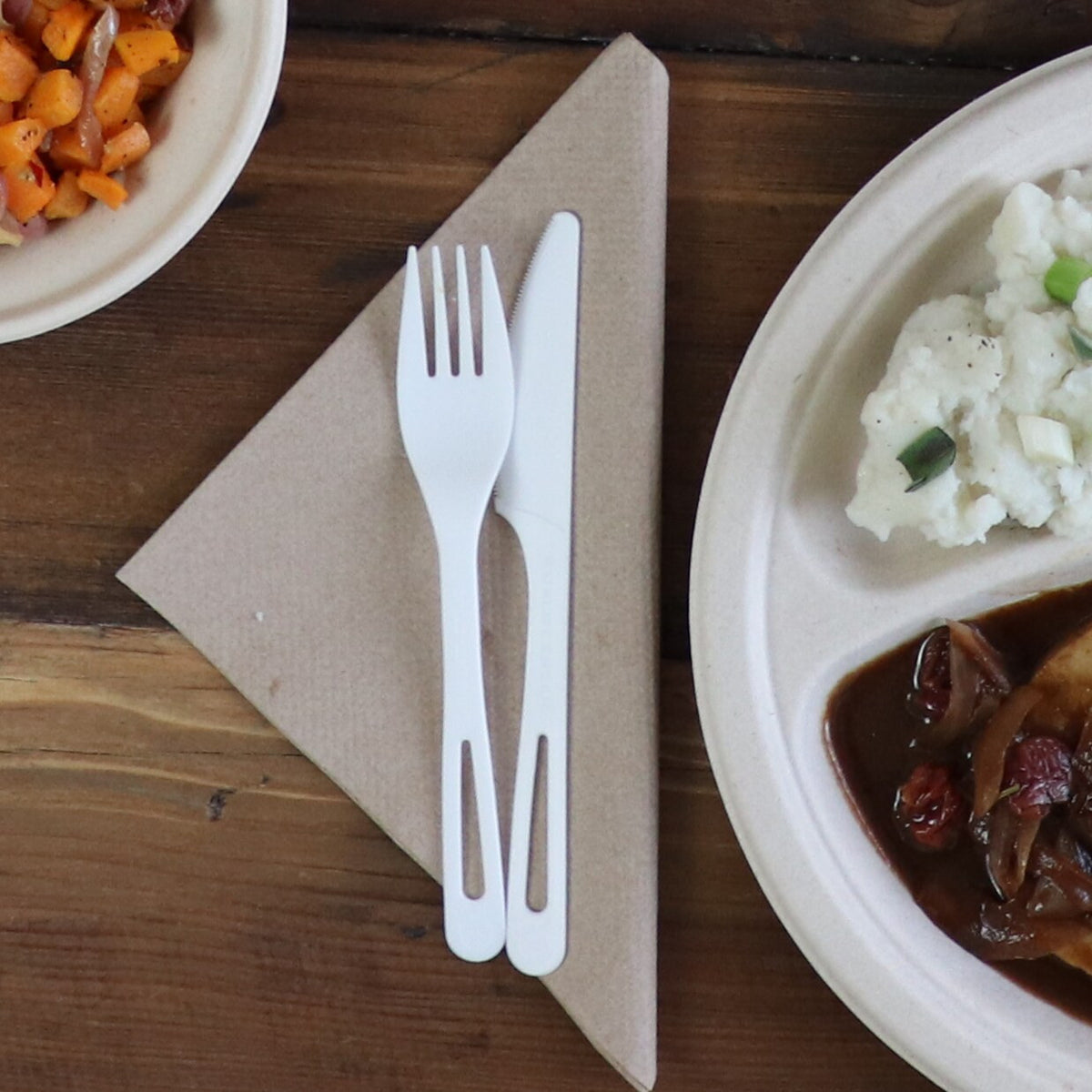 World Centric TPLA knife at a compostable dinner place setting